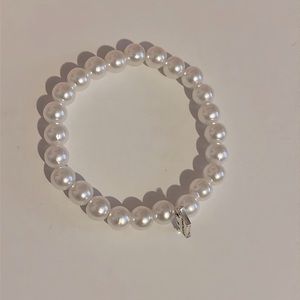 Pearl beaded bracelet with crown charm